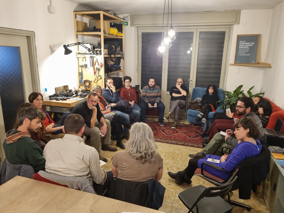 People sitting in a circle during a Transistor meeting